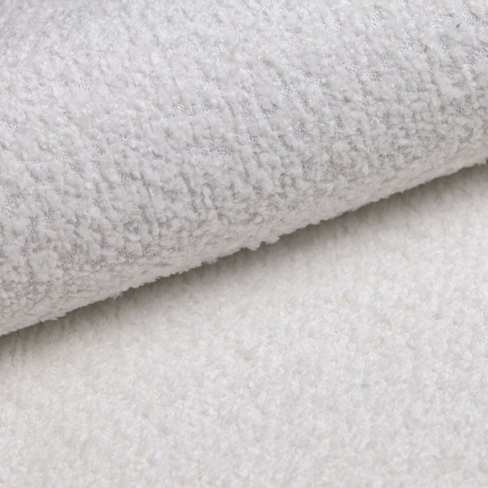 Modulares Ecksofa Yuma mit Beistellhocker aus Bouclé