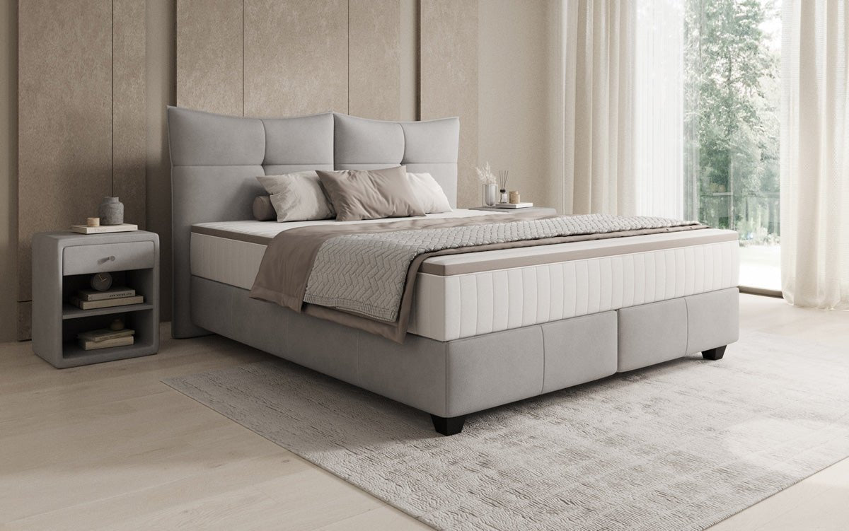 Boxspring posteľ Veyora v pravom koži