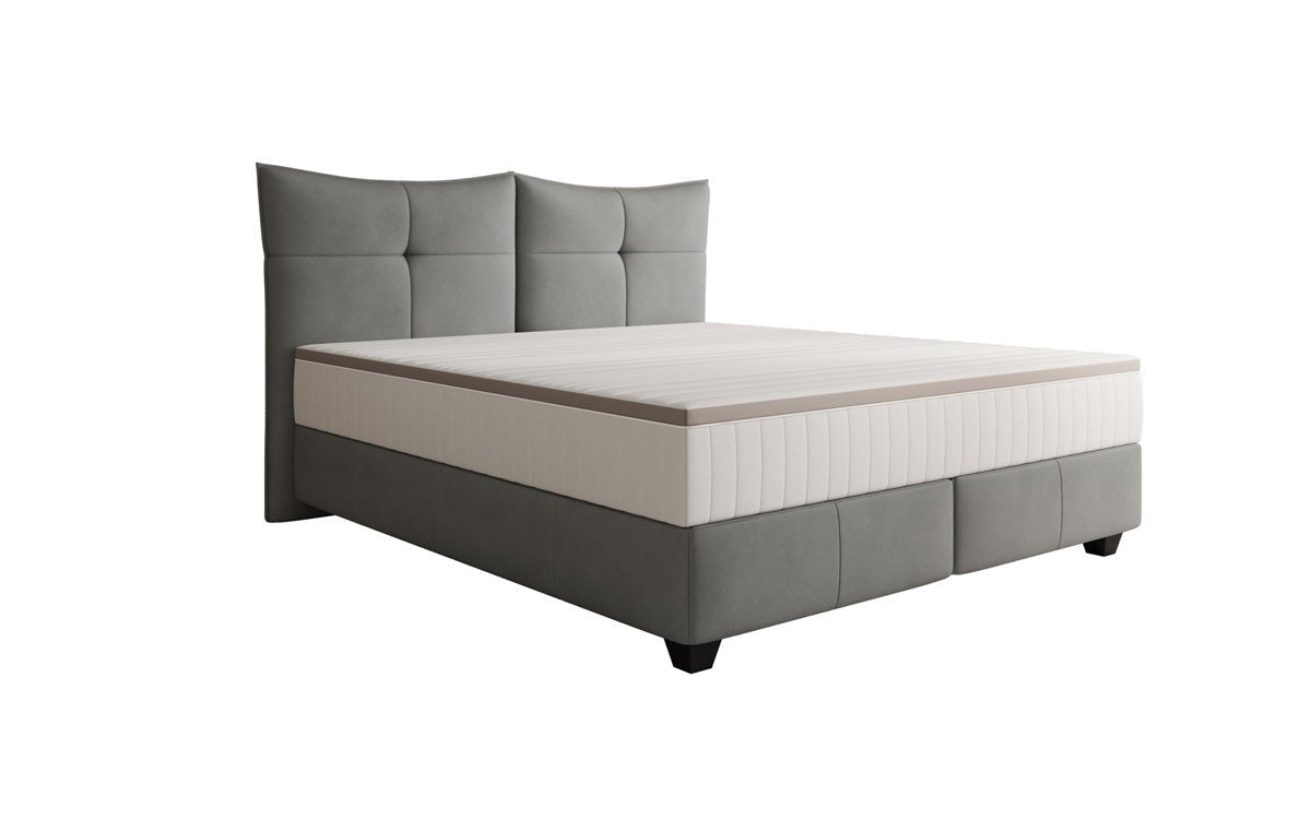 Boxspring posteľ Veyora v pravom koži