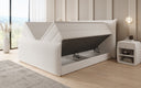 Boxspring posteľ Liana II s vysoko zdvíhateľným úložným priestorom v Teddy Bouclé