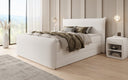 Boxspring posteľ Liana II s vysoko zdvíhateľným úložným priestorom v Teddy Bouclé